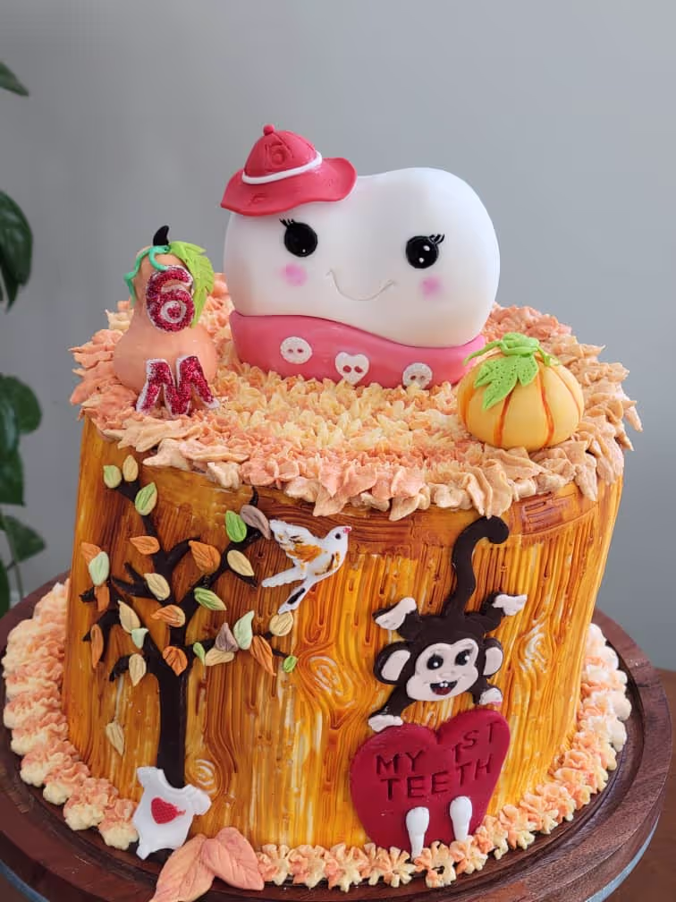 A decorated cake with an animal on top of it.